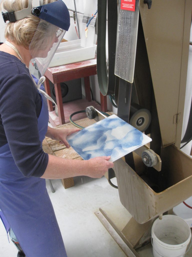 Sanding down a piece of glass